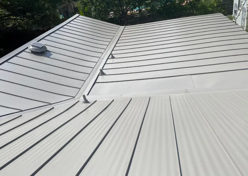 Solar attic fan installed on a metal roof for Roof Ventilation in Marion